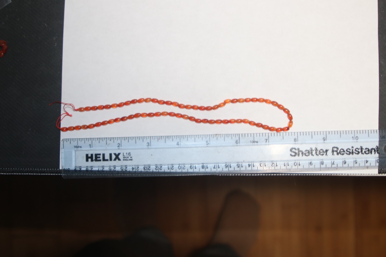 Carnelian 16in 10X5mm+- oval semi-clear strand dr3